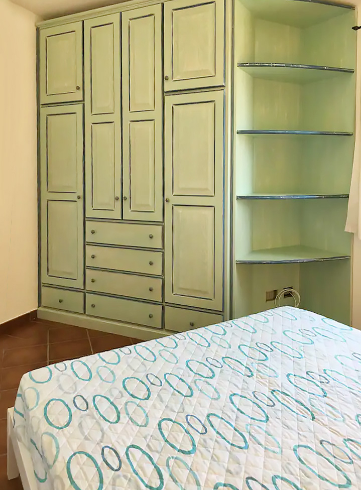 bedroom with double bed and wardrobe